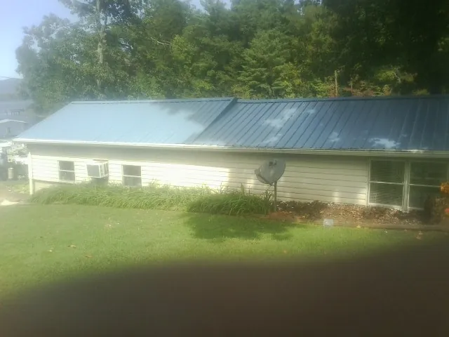 Blue metal roof running the length of a single story home in Sanford